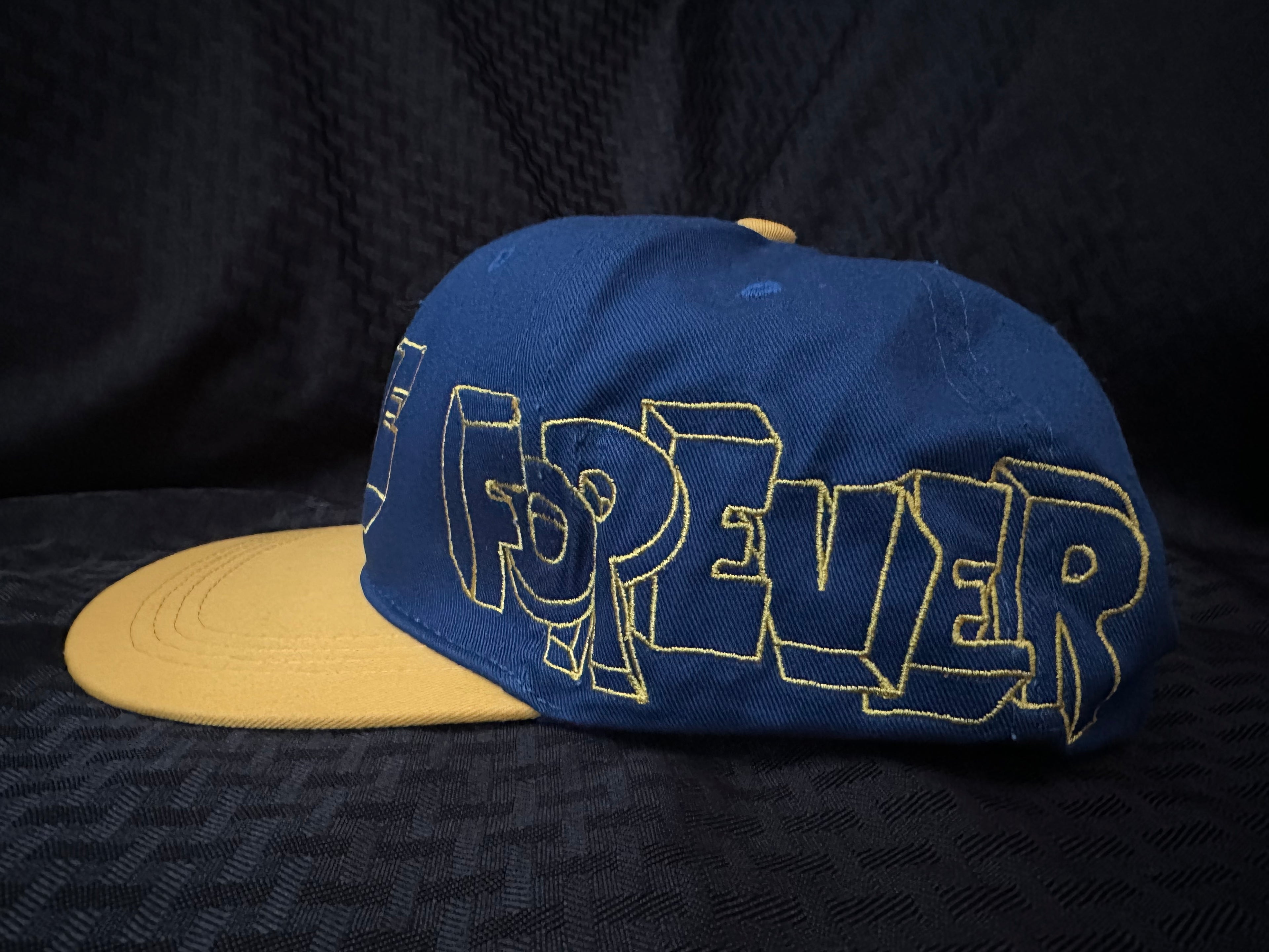 Assholes Live Forever Blue/Yellow Graffiti Hat